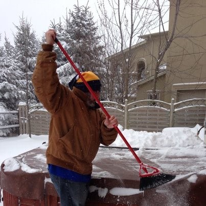 A person removing ice