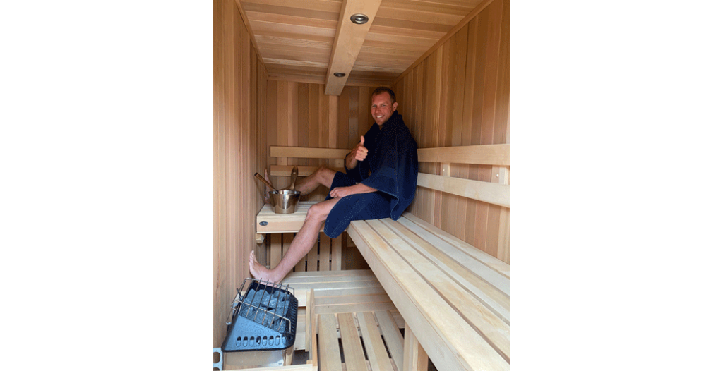 man sitting in a sauna