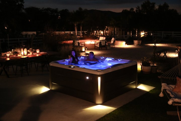 hot tub night with people inside it