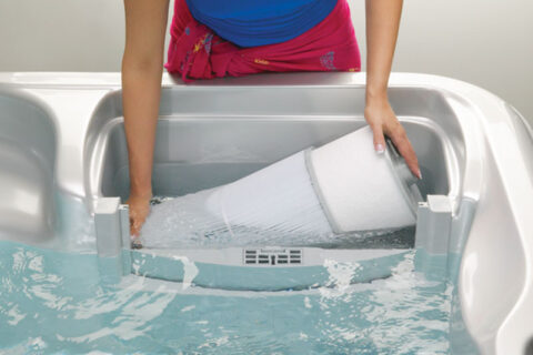 A women changing hot tub filter