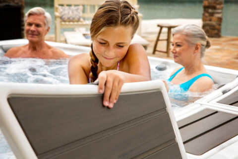 The family enjoying in the hot bath tub