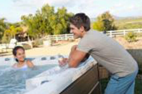 man talking with a child in smart tub