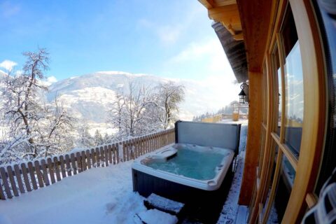 hot tub in backyard in the middle of snow